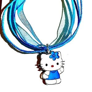 SOLD   .......SOLD...,,......All In Blue Charm On A Blue Layered Ribbon Necklace